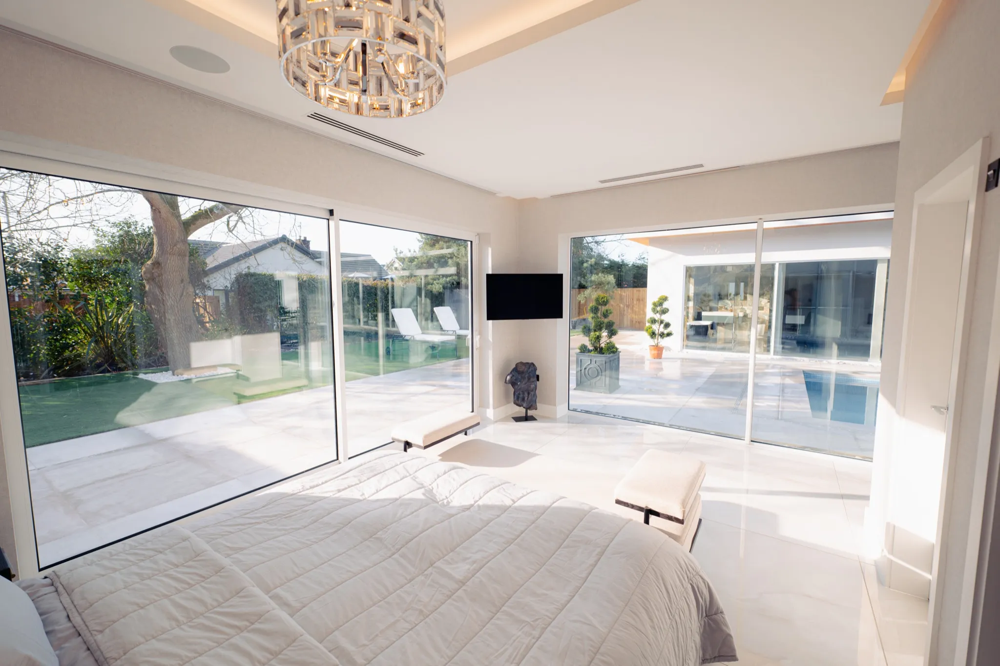 Elegant bedroom with comfortable furnishings and natural light