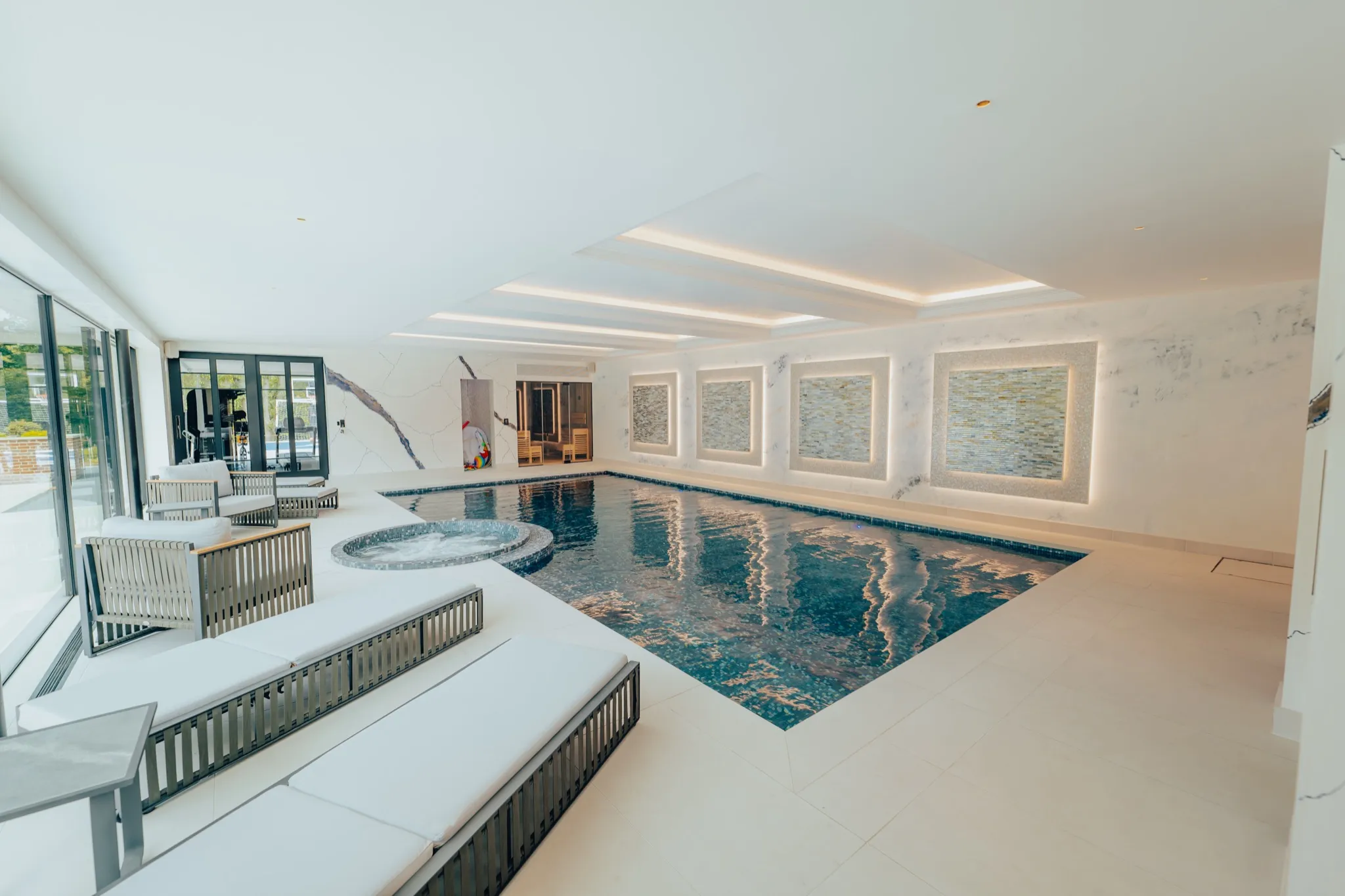 Luxury indoor pool and spa with ambient lighting