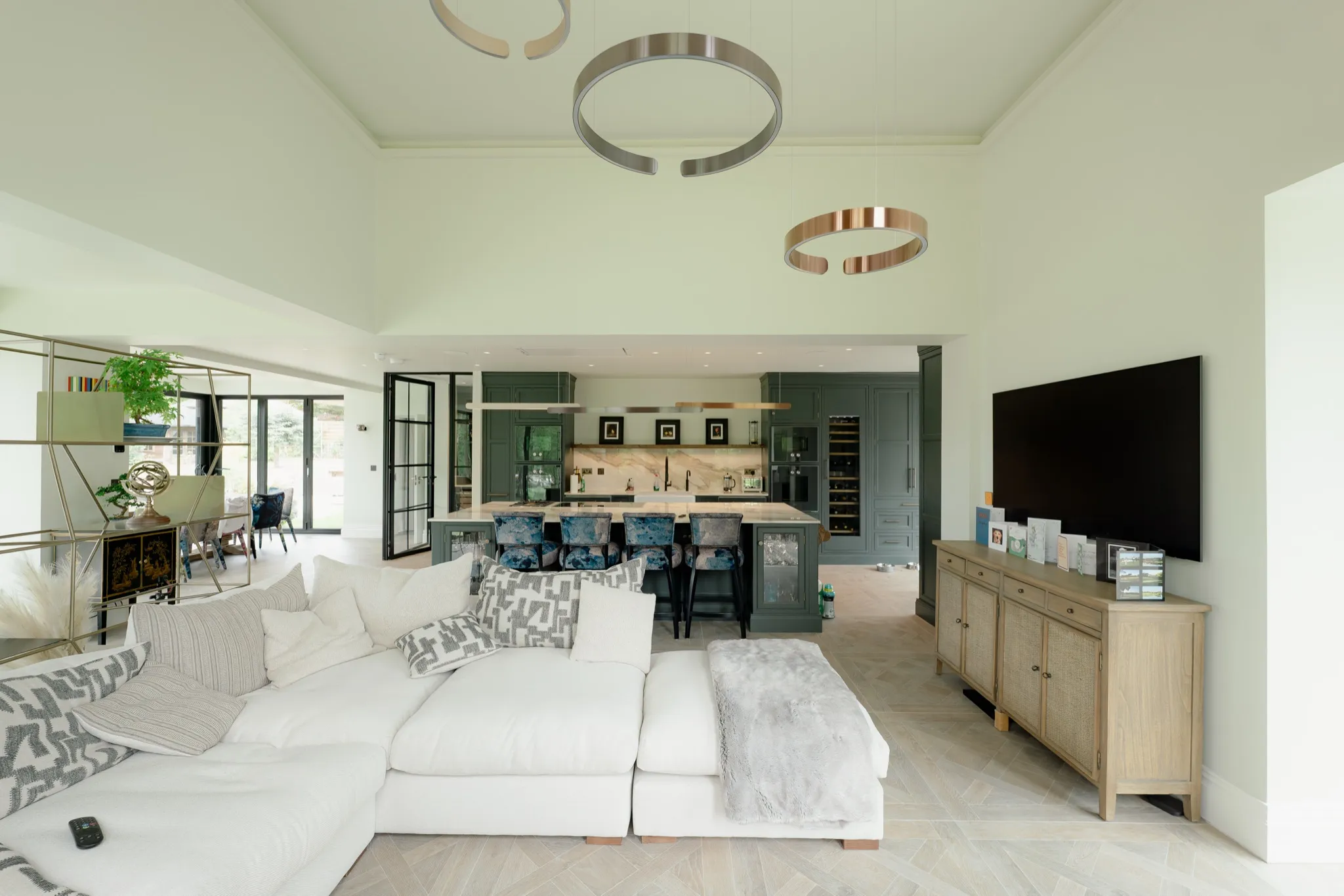A modern living room with a large screen streaming content