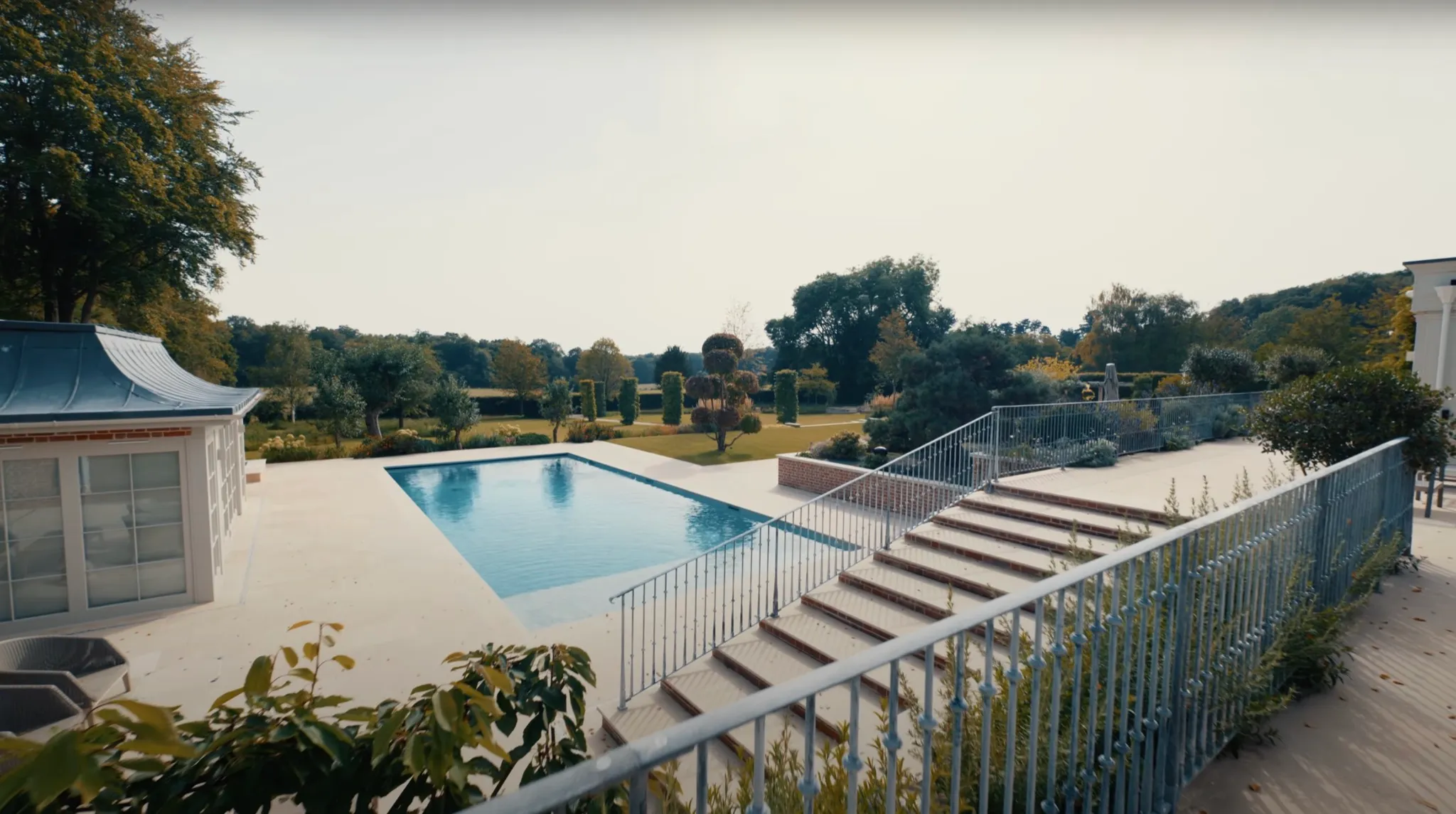 Beautiful outdoor entertaining area with pool and landscaping